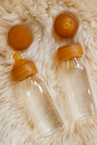 Quoddle Baby Glass Baby Bottle Natural Rubber Teat Nipple Nursing on Sheep skin rug Abel Series