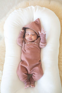Newborn on Snuggle Me Organic Positioner wearing Wee Seedling clothing