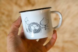 Enamelware enamel mug white with black rim and mushroom birds nest art